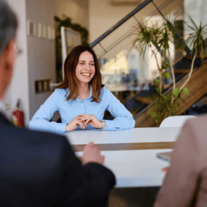 Woman in blue shirt at meeting