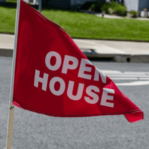 Red open house flag outdoors