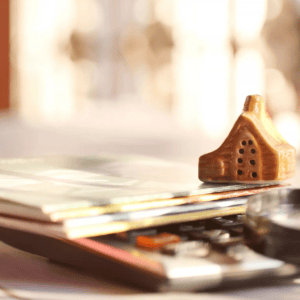 House model on stack of books